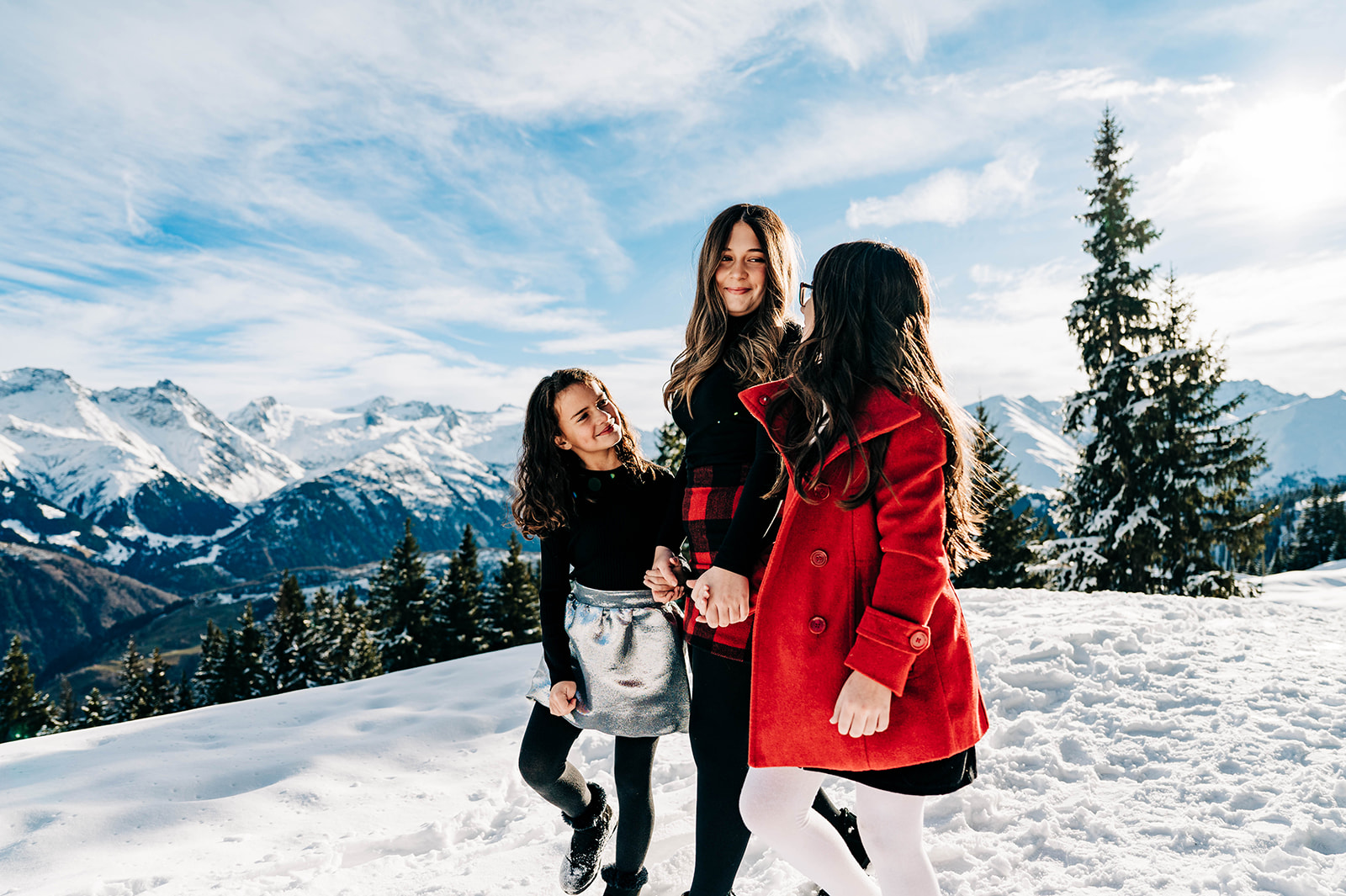 Girls enjoying snow in Swiss Alps