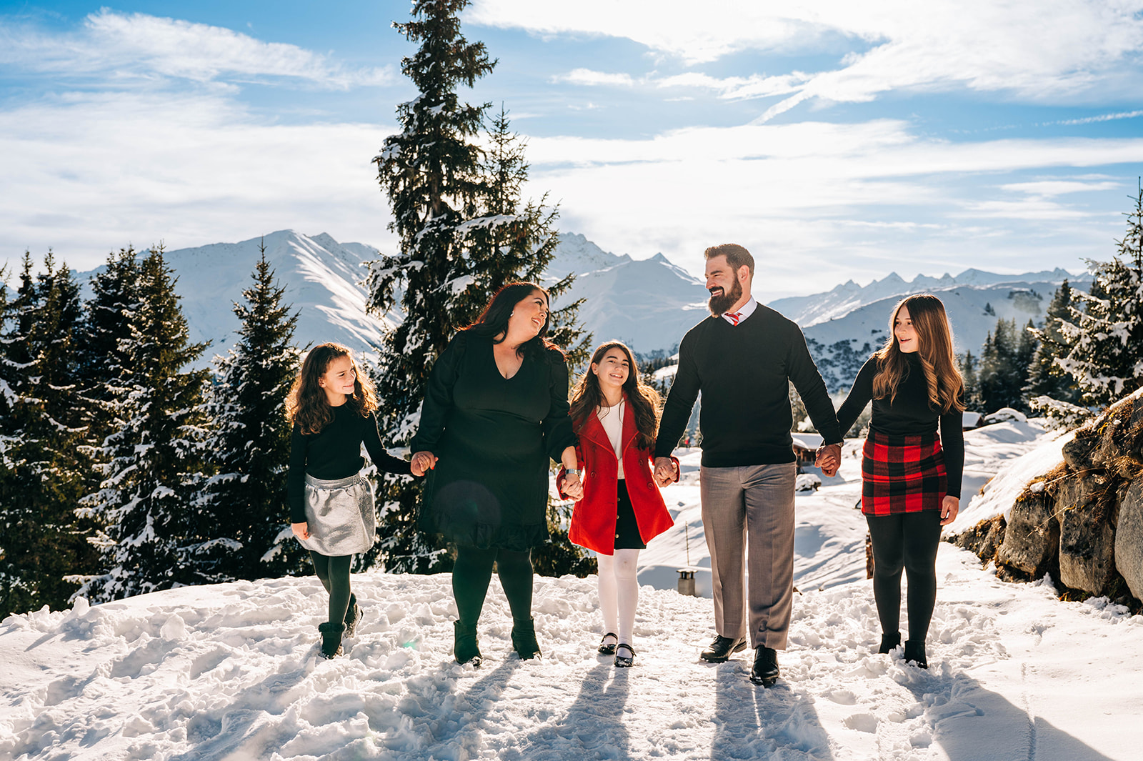 Family Enjoying Sunshine in Swiss Alp for Family Photos Switzerland