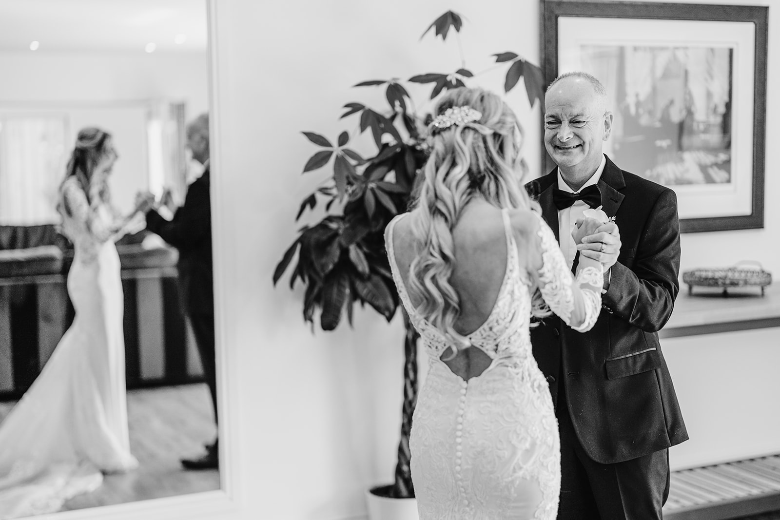 a black and white picture of an emotional father of the bride seeing her for the first time at Quantock Lakes Somerset 