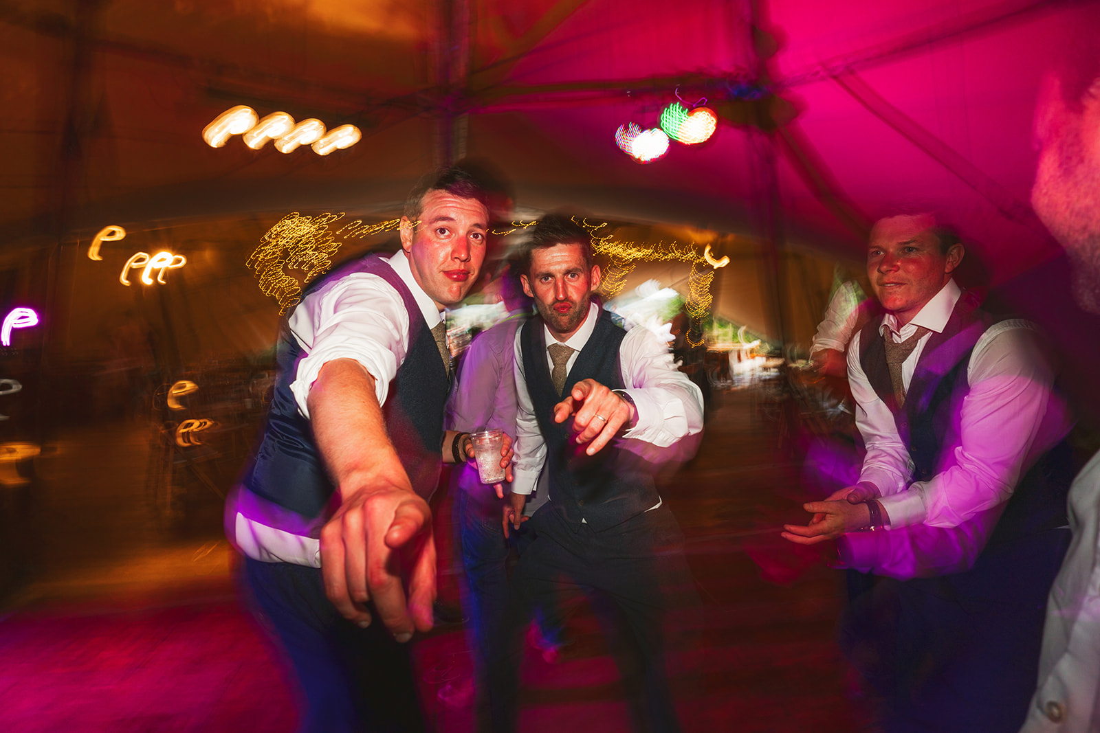 groomsmen making funny faces whilst dancing at Chew Valley Weddings