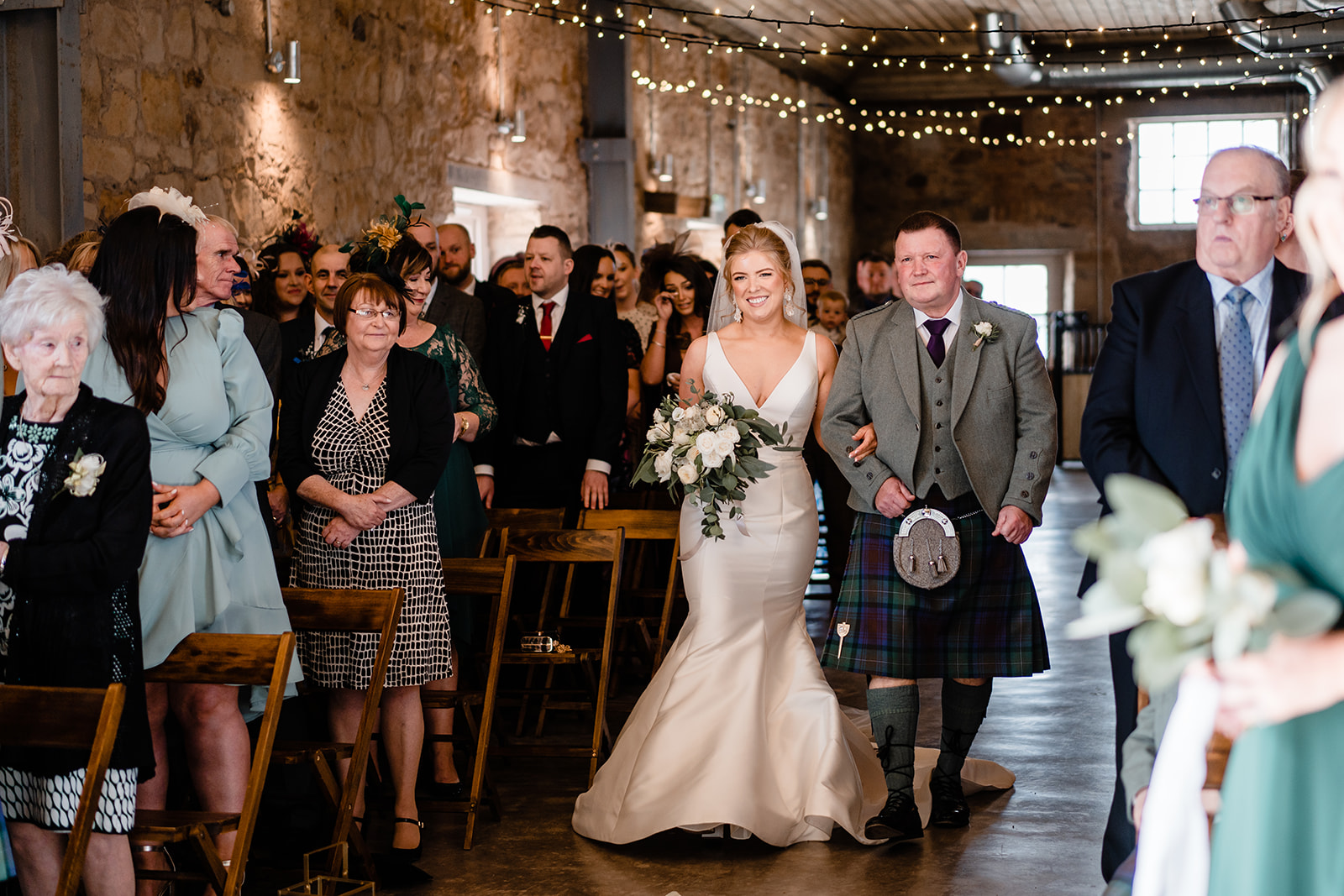 bride walking down the aisle at falside mill st andrews