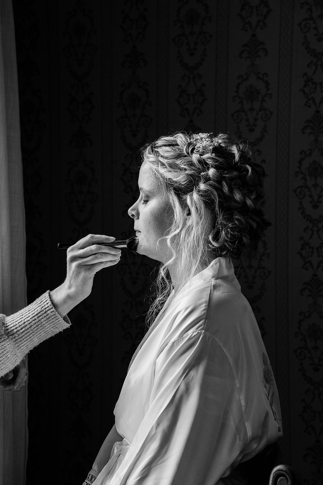 black and white image of bride getting ready Zara Davis Wedding Photography Cotswolds Grittleton House Gloucestershire W
