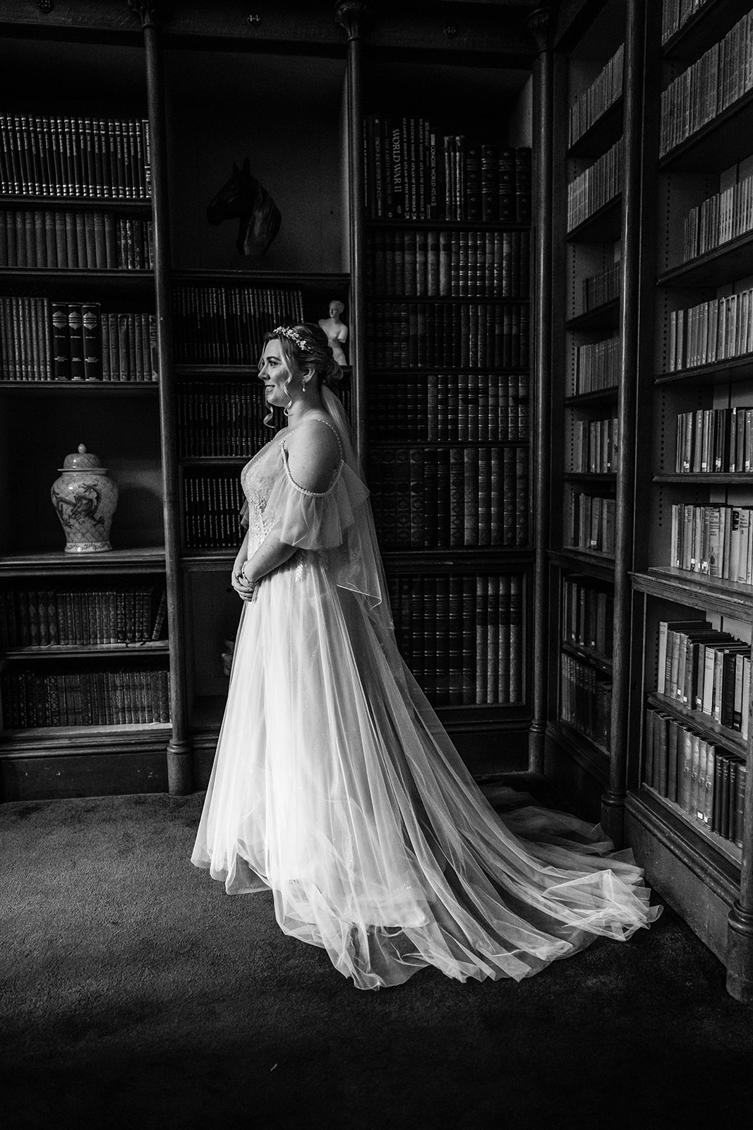 black and white bridal portrait in the library Zara Davis Wedding Photography Cotswolds Grittleton House Gloucestershire