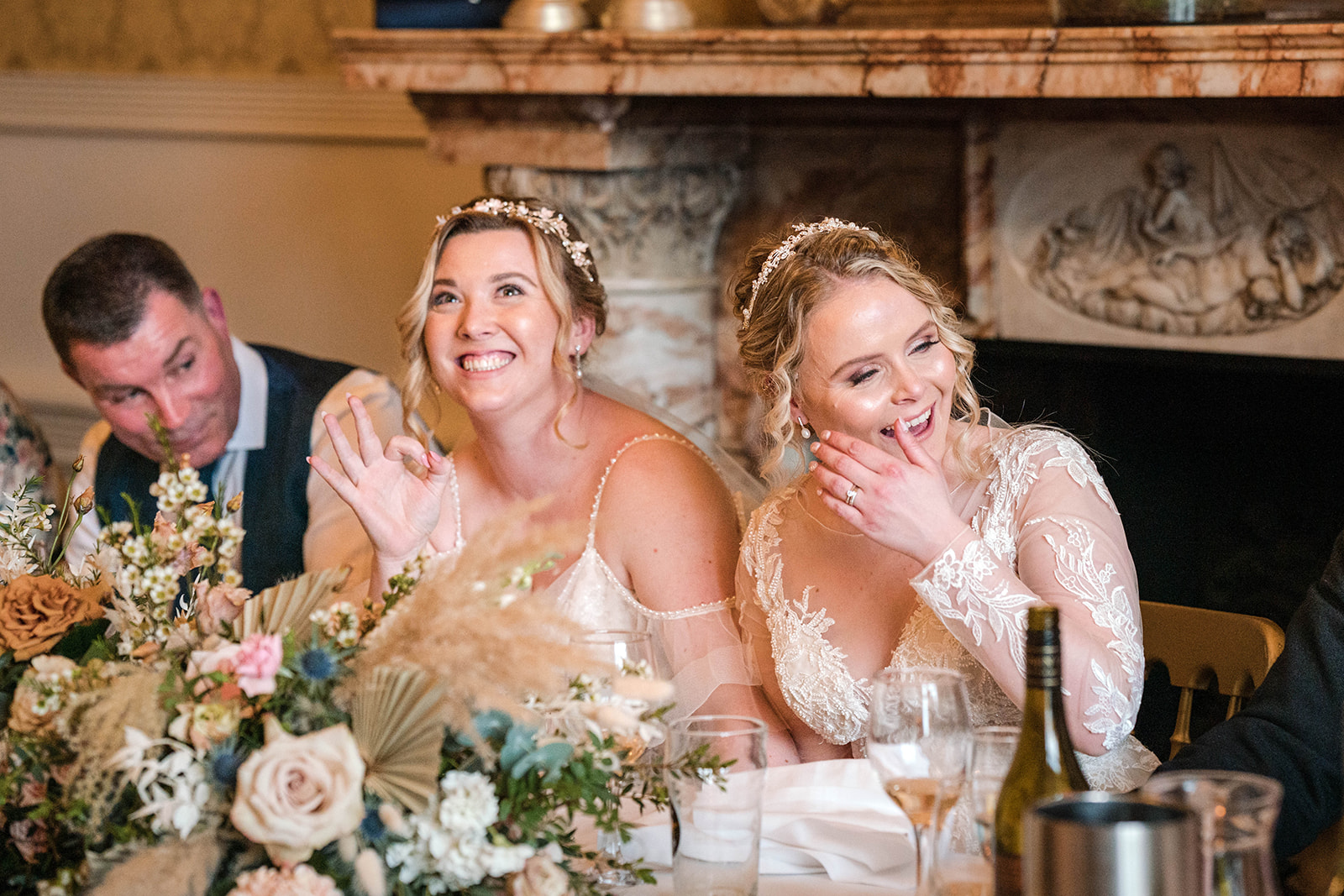 brides giggling during speeches Zara Davis Wedding Photography Cotswolds Grittleton House Gloucestershire Wiltshire