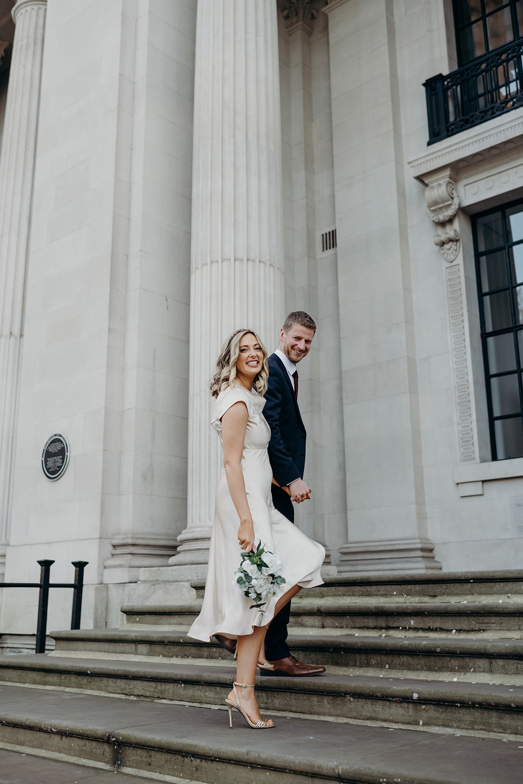 Couples wedding portraits on the steps at Old Marylebone Town Hall