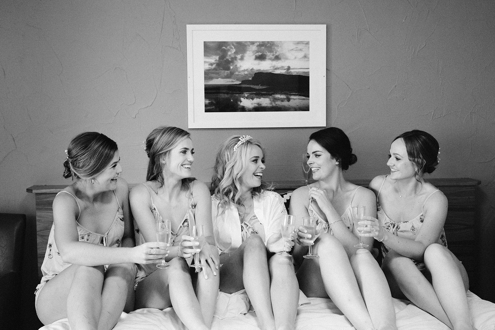 bridesmaids on a bed