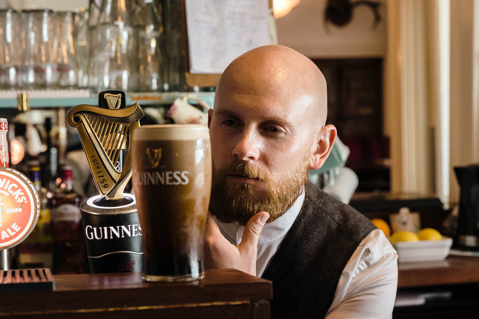 groom with pint of guinness