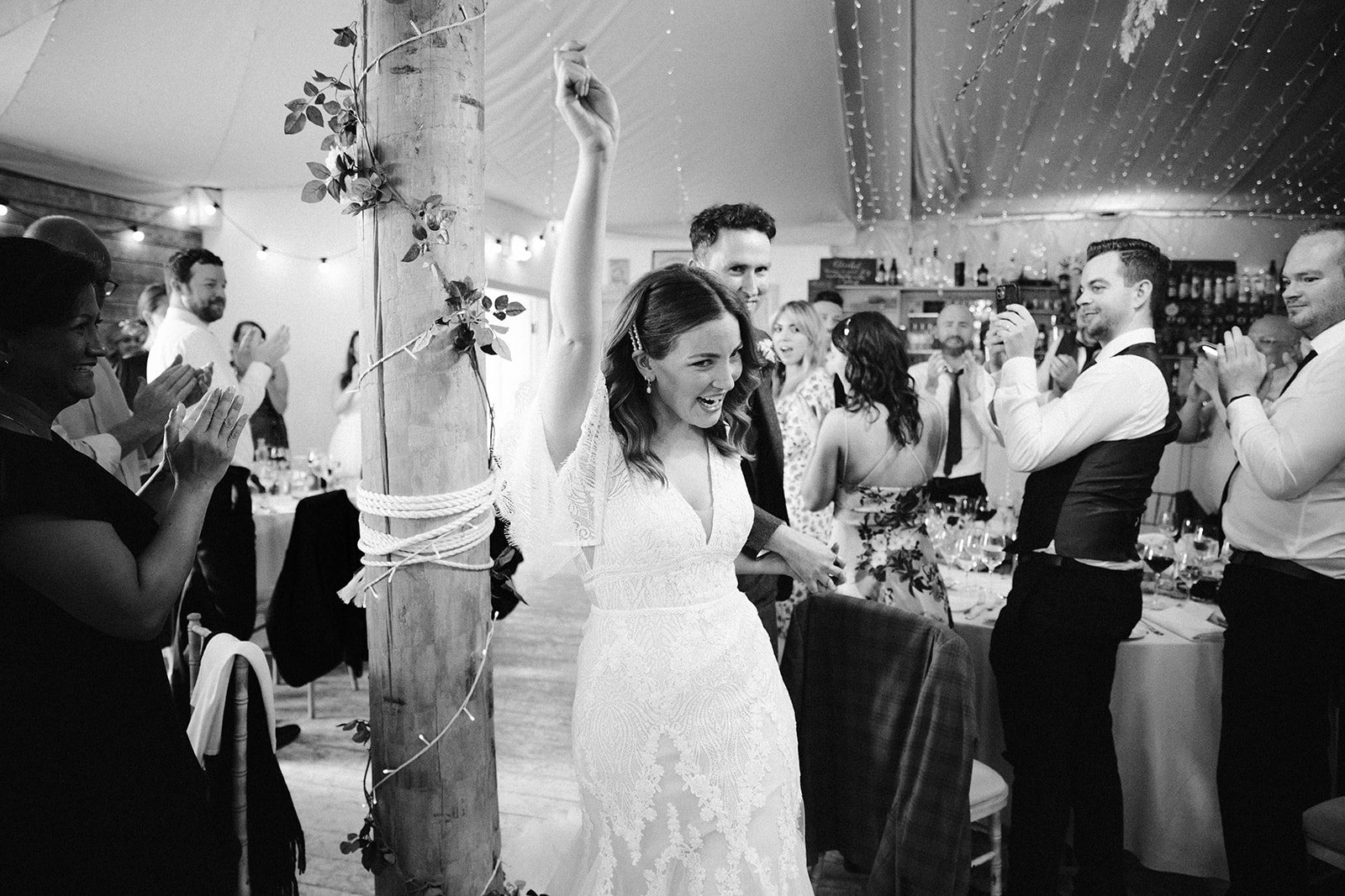 bride cheers coming in to wedding dinner