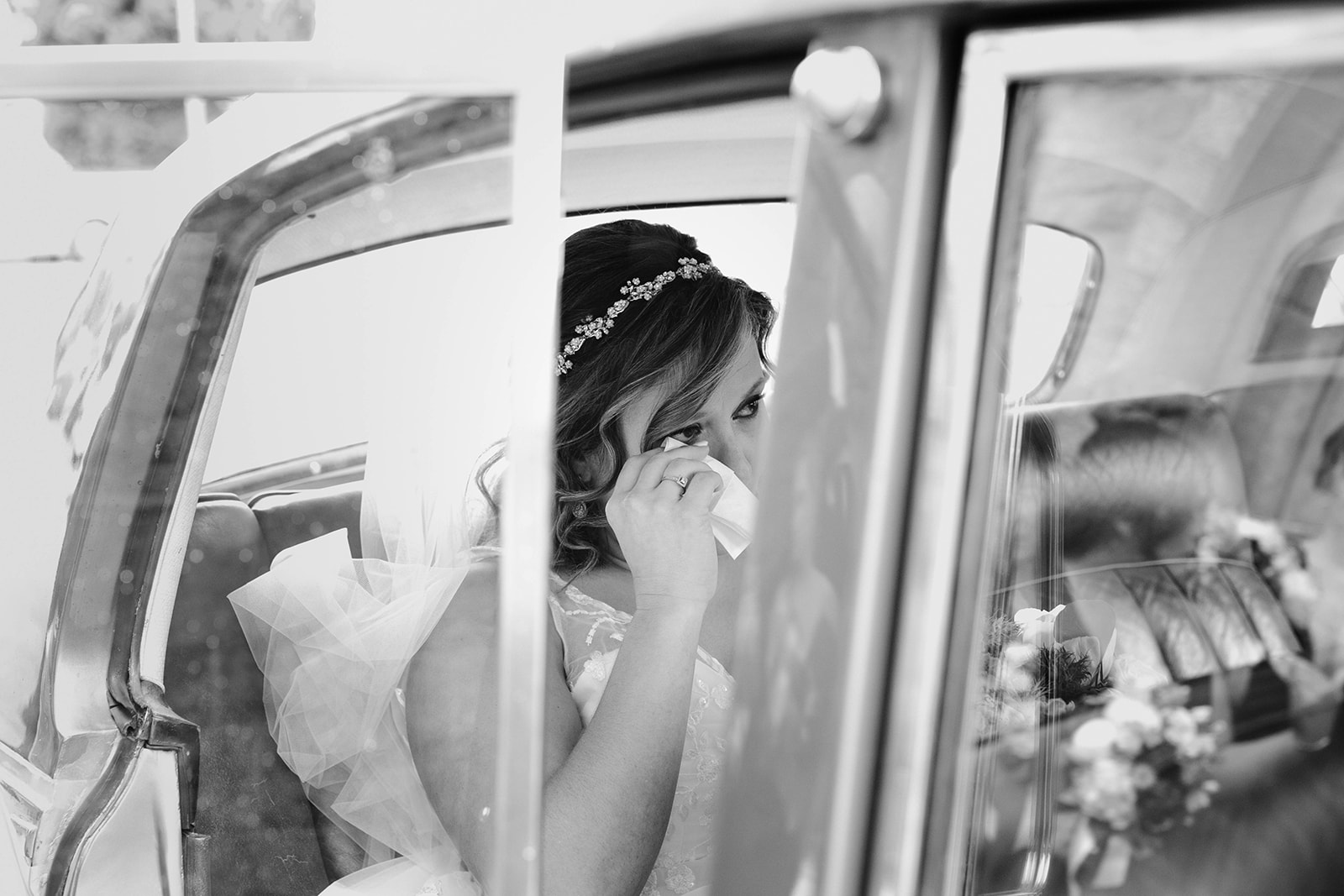 bride cries in car before getting married