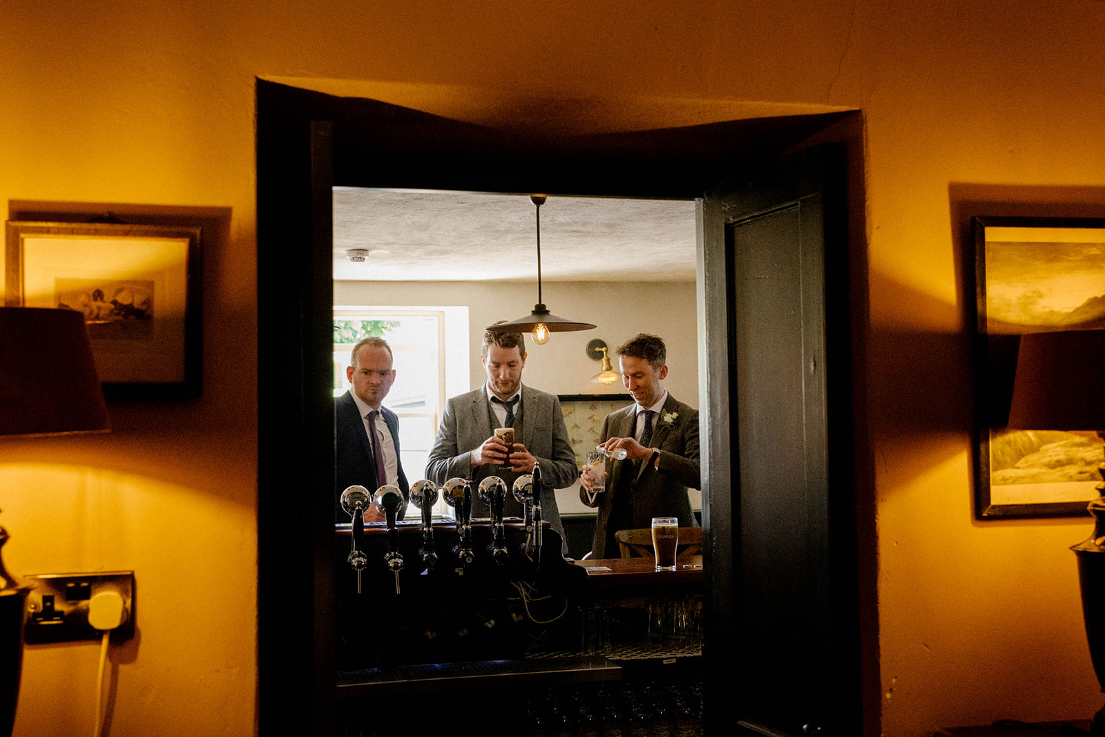 groom framed in pub