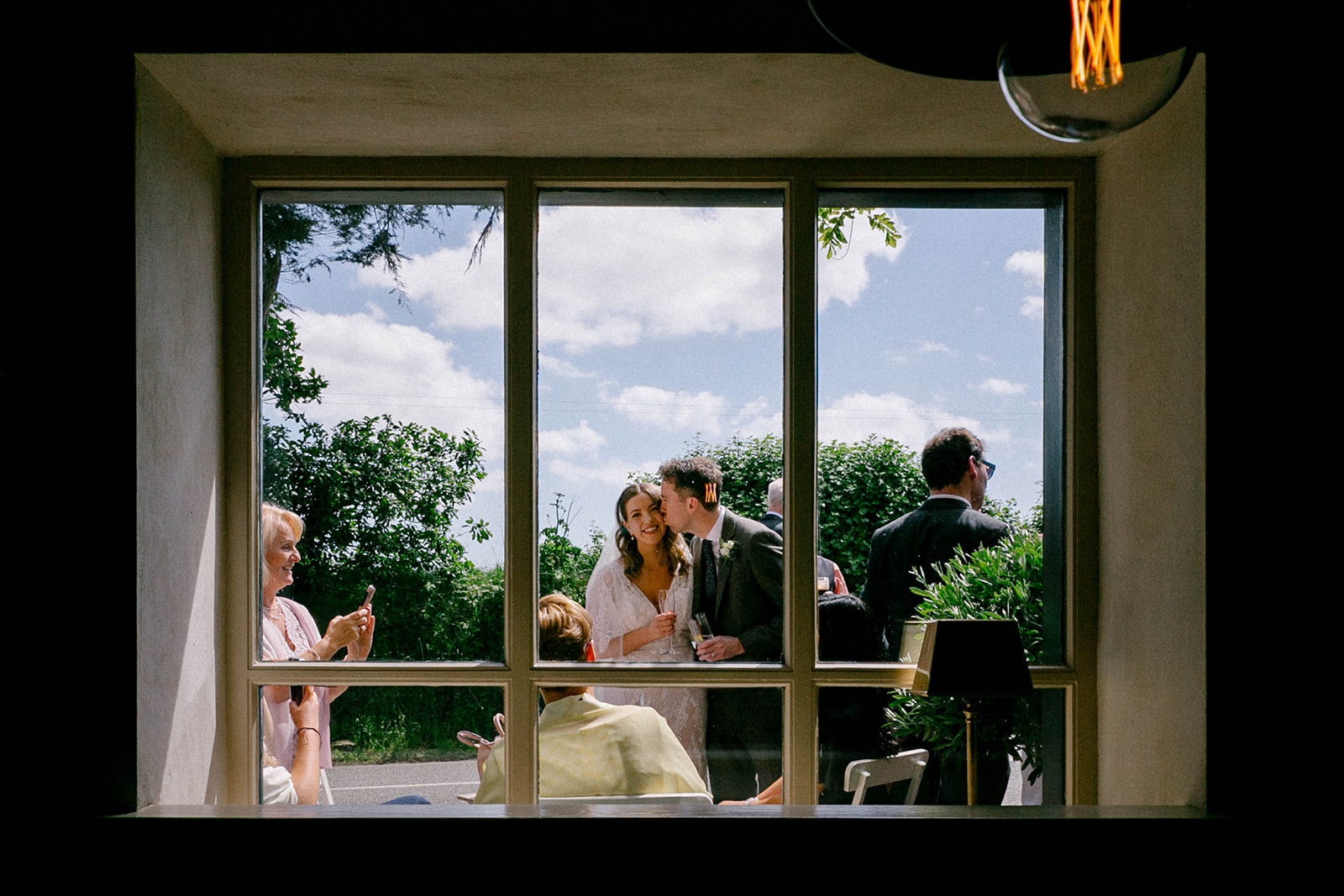 wedding couple through a window