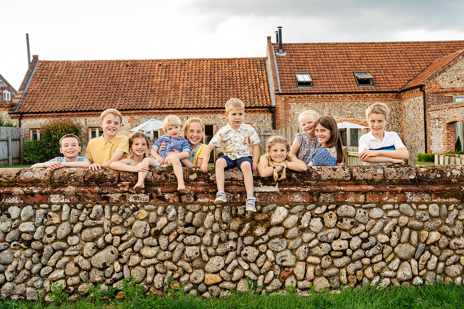 An extended family posing for a group shot of the grandchildren in their north Norfolk holiday home