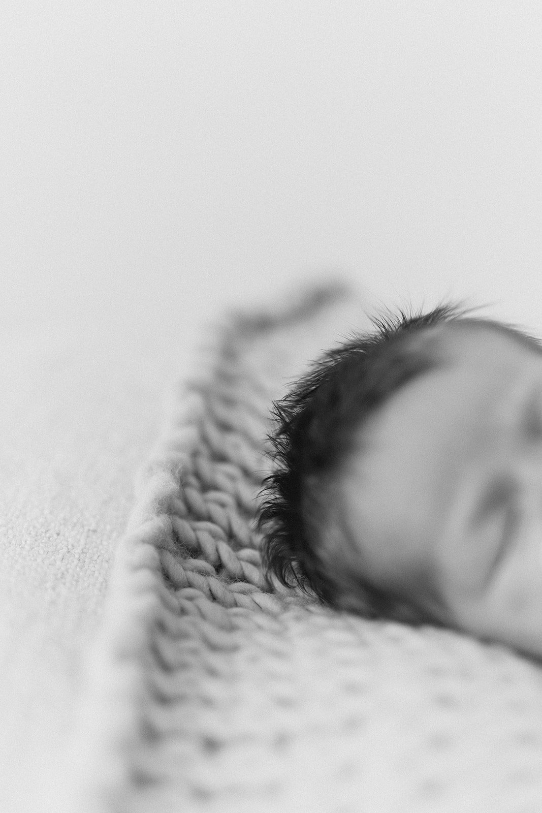 Newborn baby girl with spikey hair in RinkaDink Studio, Belfast, Northern Ireland.