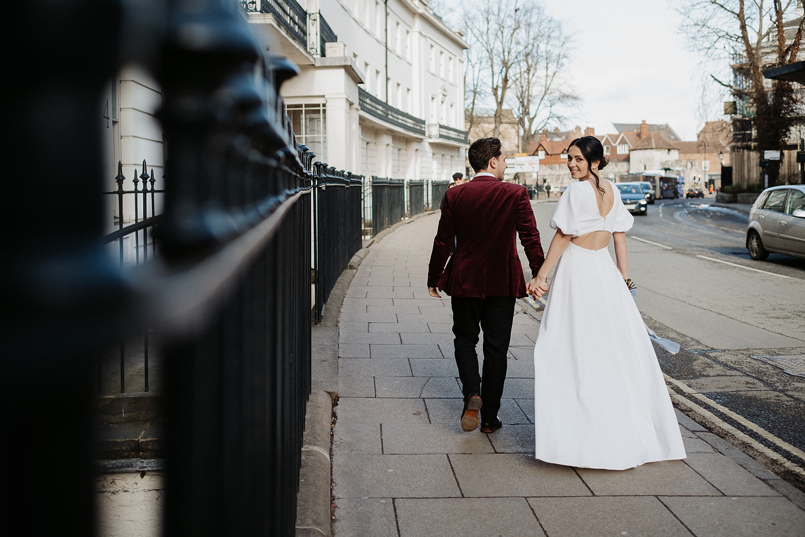 bride and groom walk the streets of York for their intimate wedding