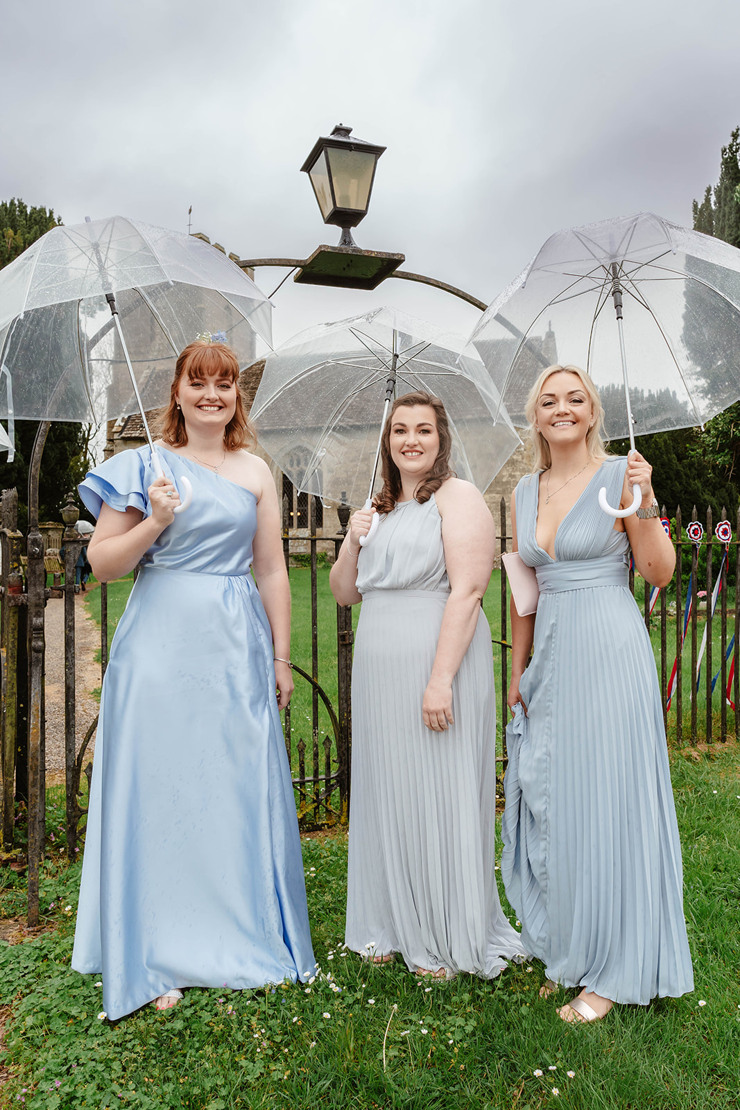 Zara Davis Wedding Photography Moor Farm Moreton Valance Gloucestershire Cotswolds bridesmaids with umbrellas