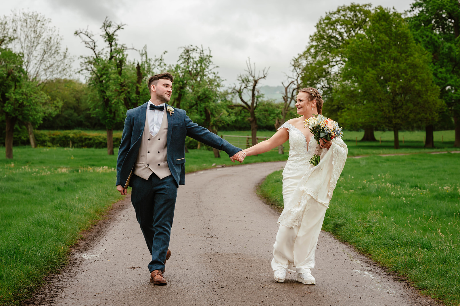 Zara Davis Wedding Photography Moor Farm Moreton Valance Gloucestershire Cotswolds bride groom walking down driveway