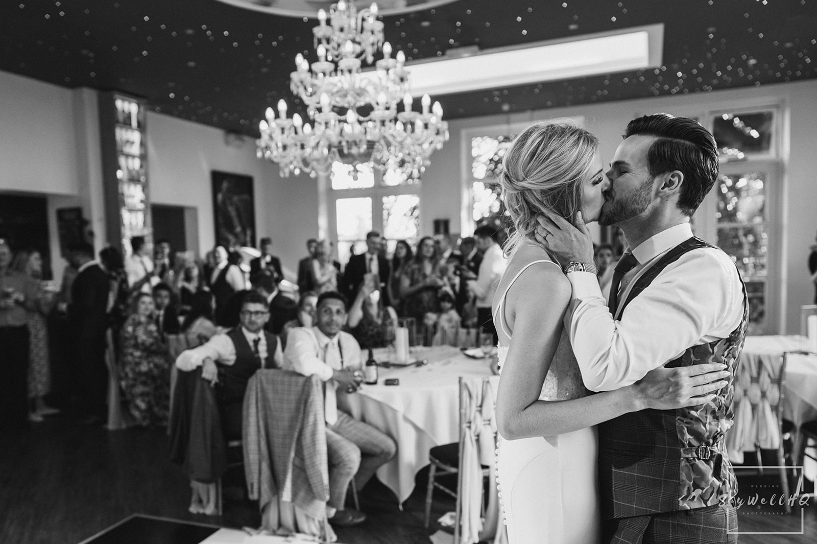 Wedding Photography First dance photos - 
Bride and groom kiss during the first dance