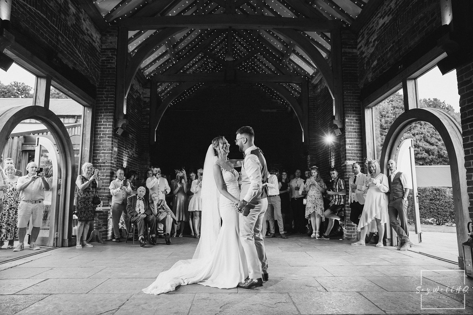 Wedding Photography First dance photos - bride and groom first dance in a converted barn
