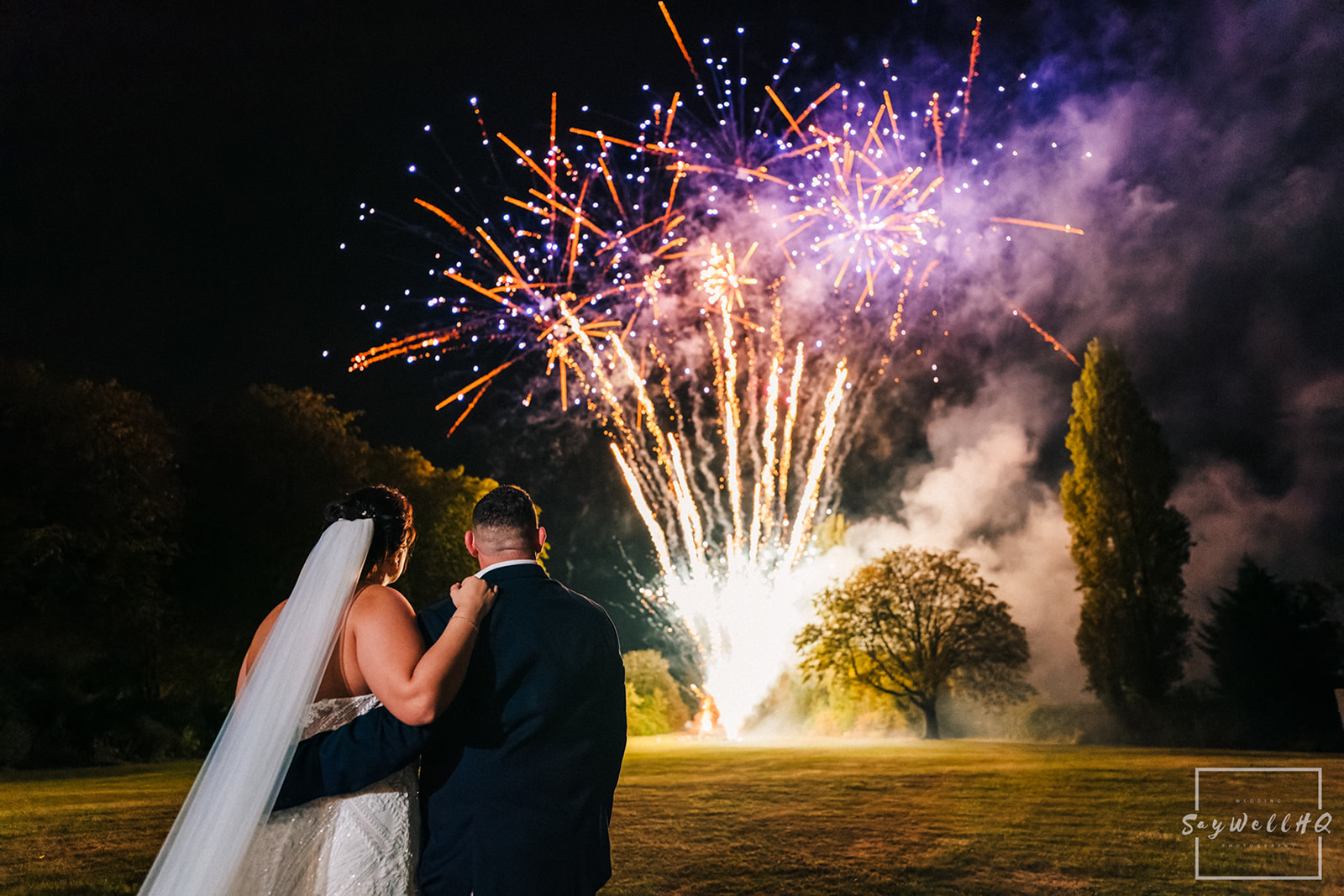 Documentary Wedding Photography Portfolio - bride and groom looking on during the fireworks display