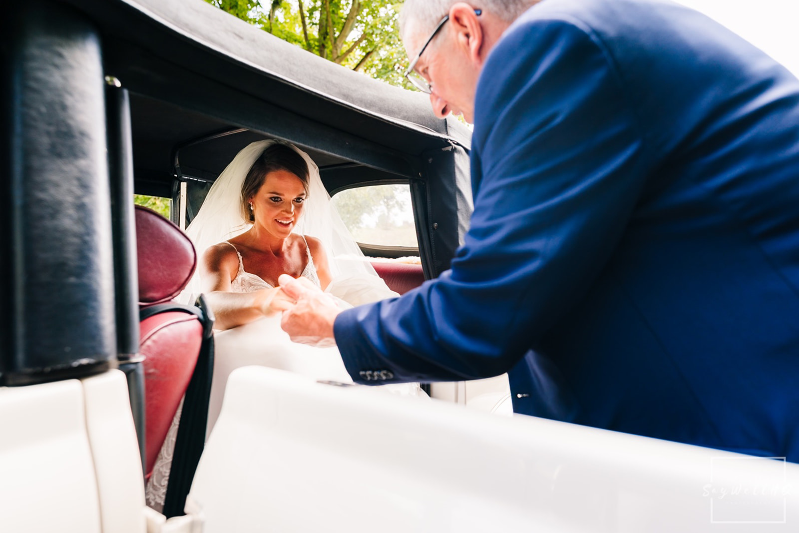 Documentary Wedding Photography Portfolio - Andy Saywell - bride arrives for her wedding in a white wedding car