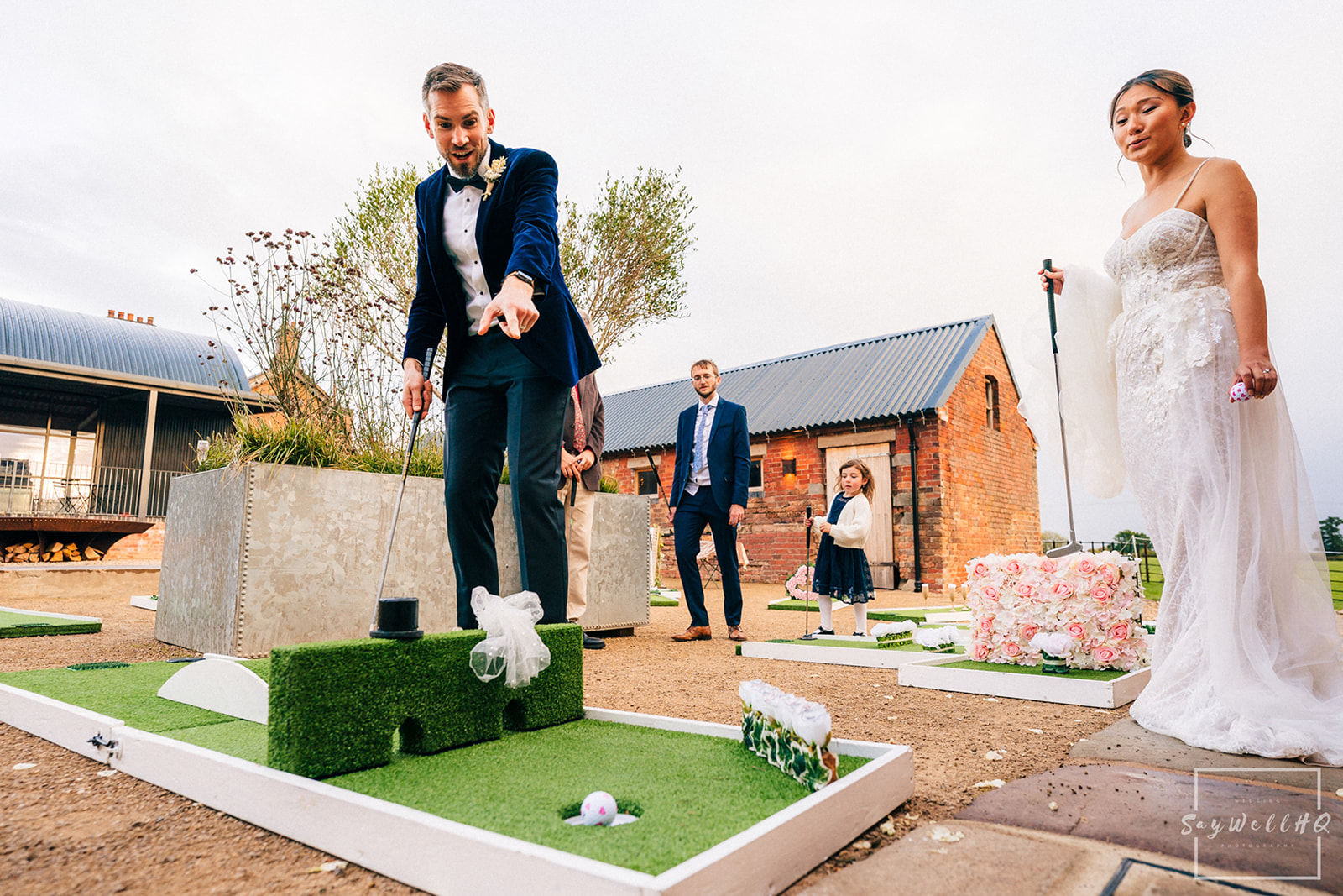 Documentary Wedding Photography Portfolio - Andy Saywell bride and groom playing golf at their wedding
