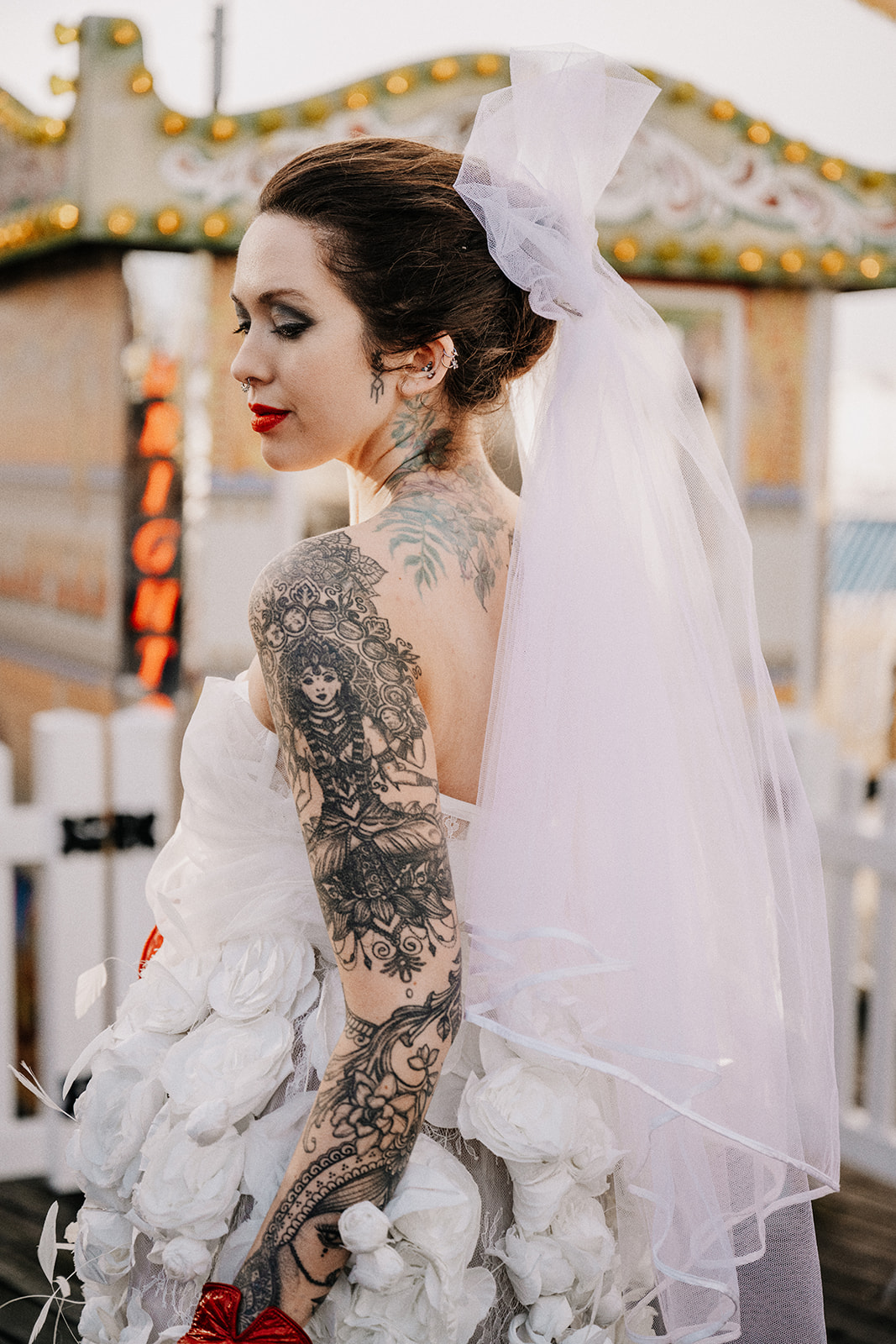 A tattoed bride in a wedding dress