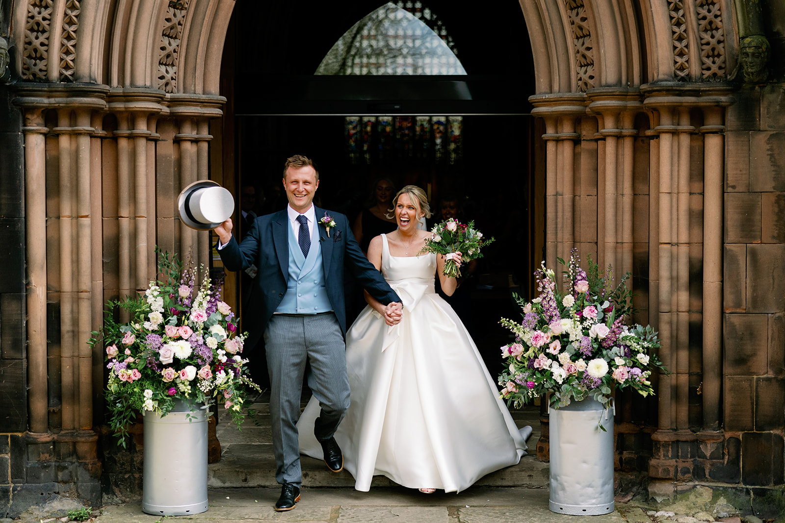 bride and groom exiting st marys church in nantwich