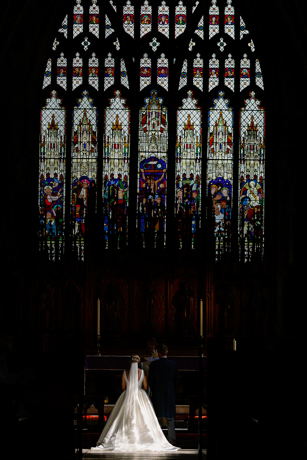 a photo of the bride and groom stood at the front of st marys church in nantwich