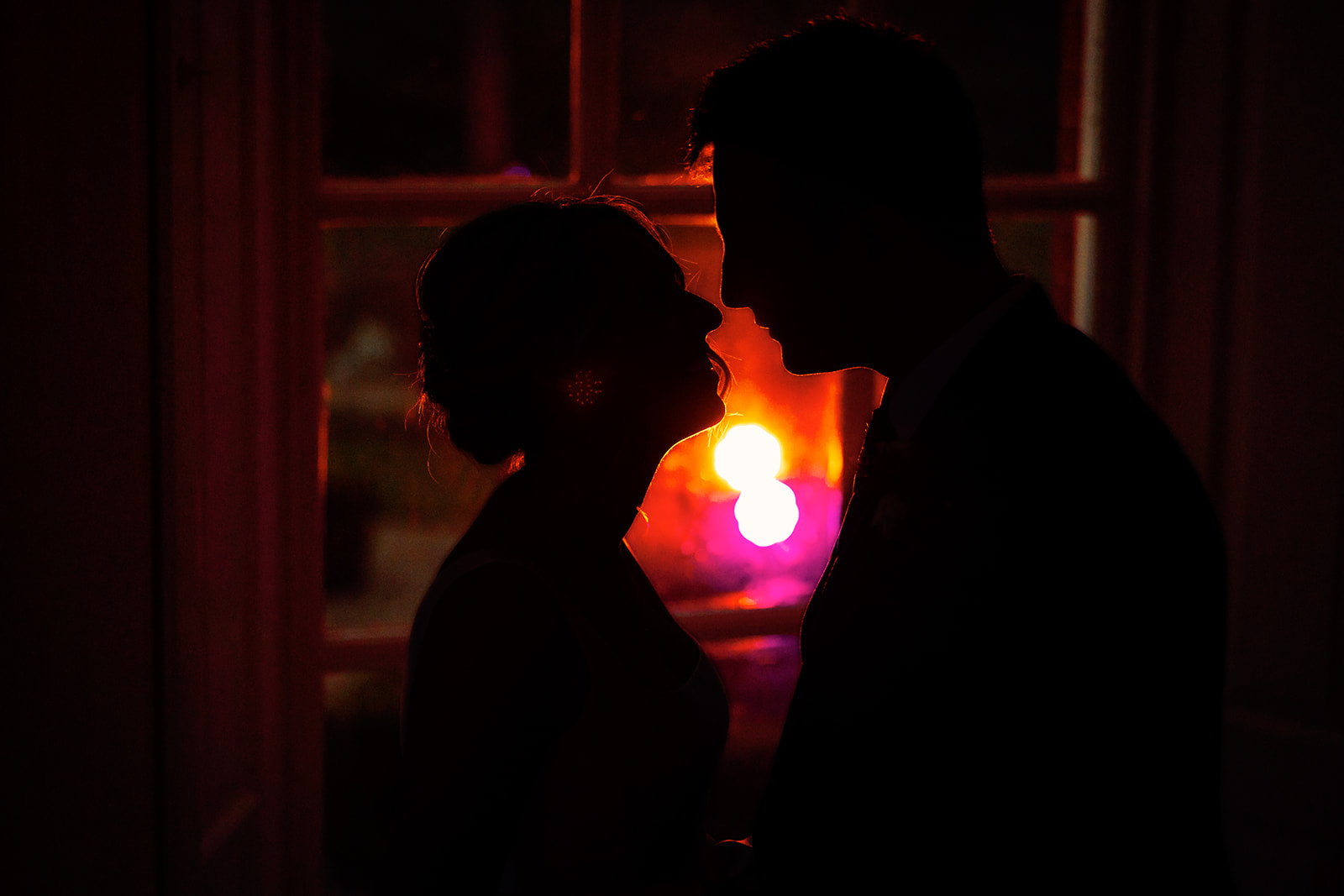 a silhouette of the bride and groom at iscoyd park