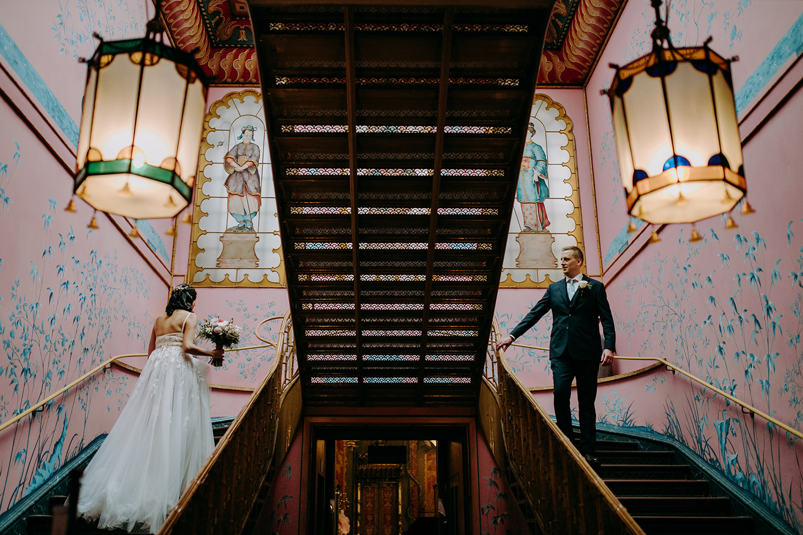 royal pavilion wedding with couple on pink staircase