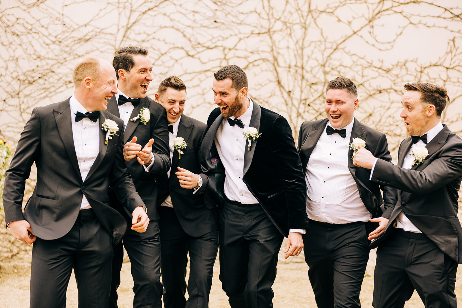 A groom and his grooms men enjoying some fun in clonabreany house courtyard