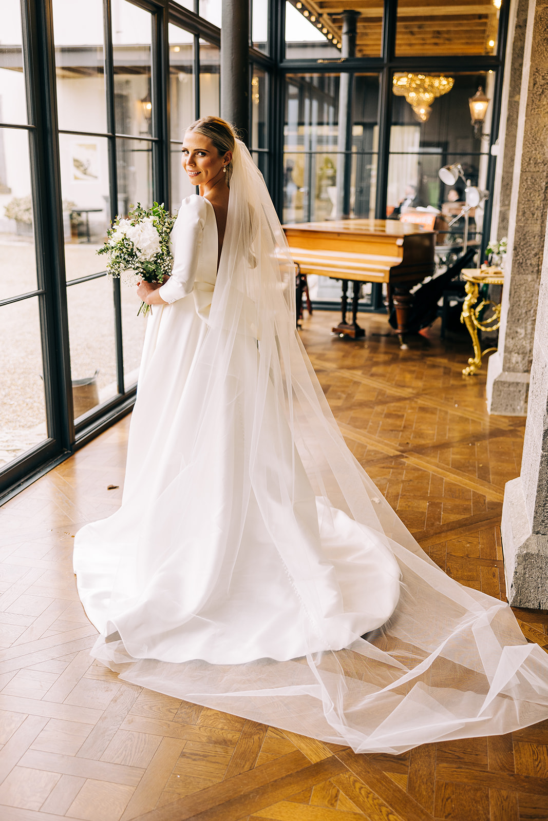 Katie poses for a photo showing off her wedding dress in clonabreany house