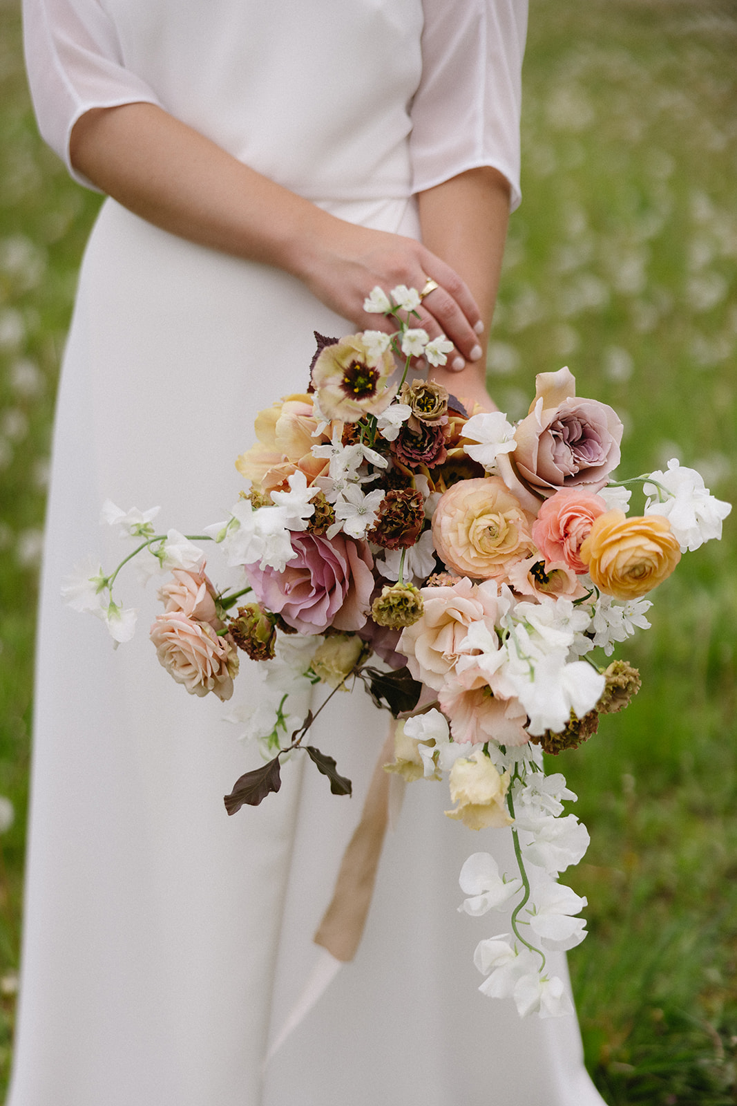 Bride's exquisite bridal bouquet with minimalist floral arrangement