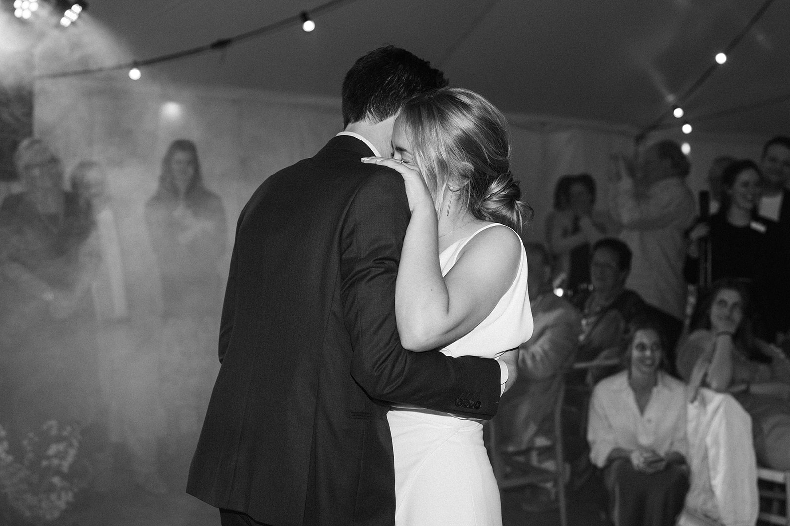 Romantic first dance under twinkling string lights