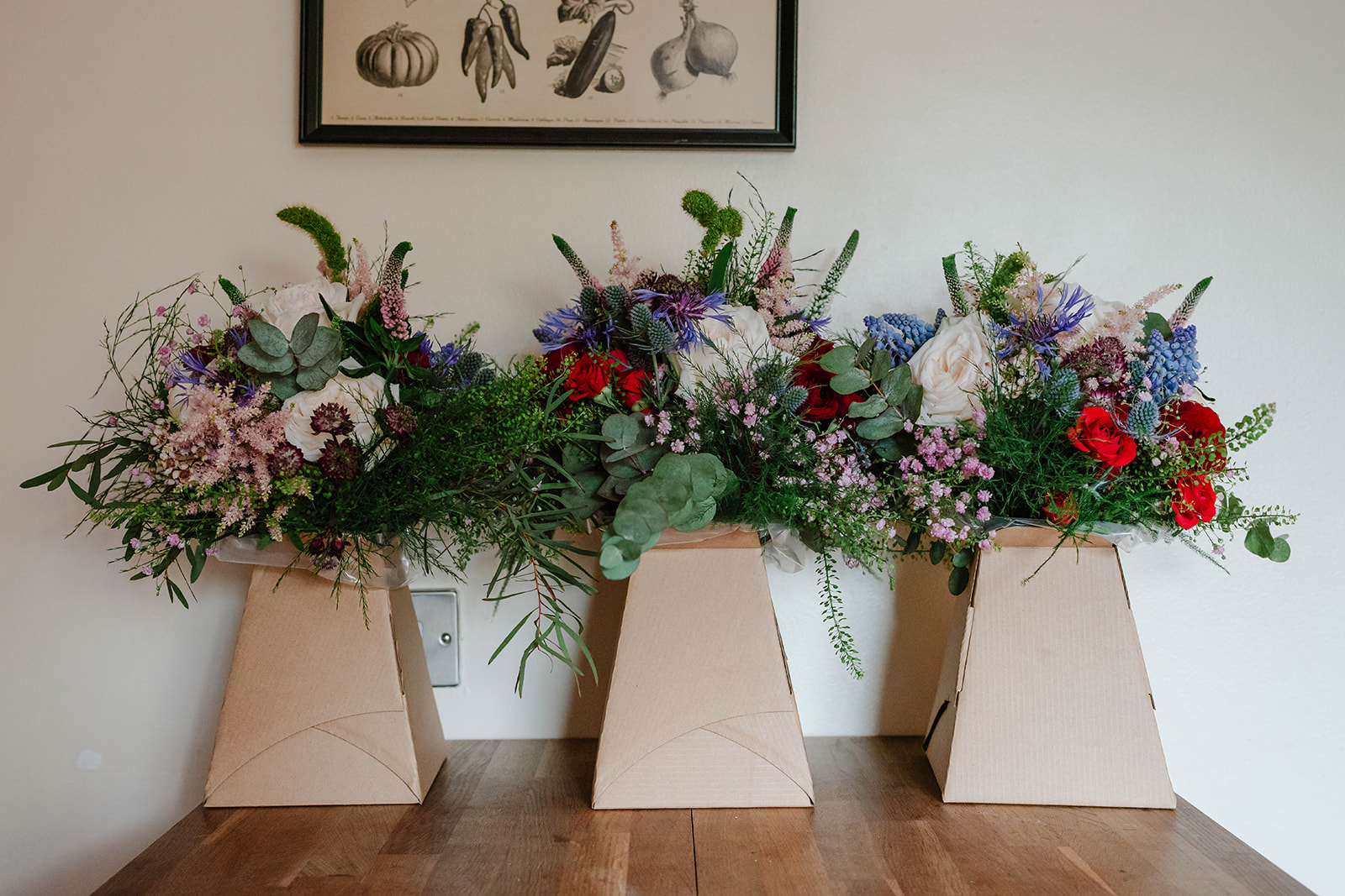 3 bridesmaids' bouquets on a table