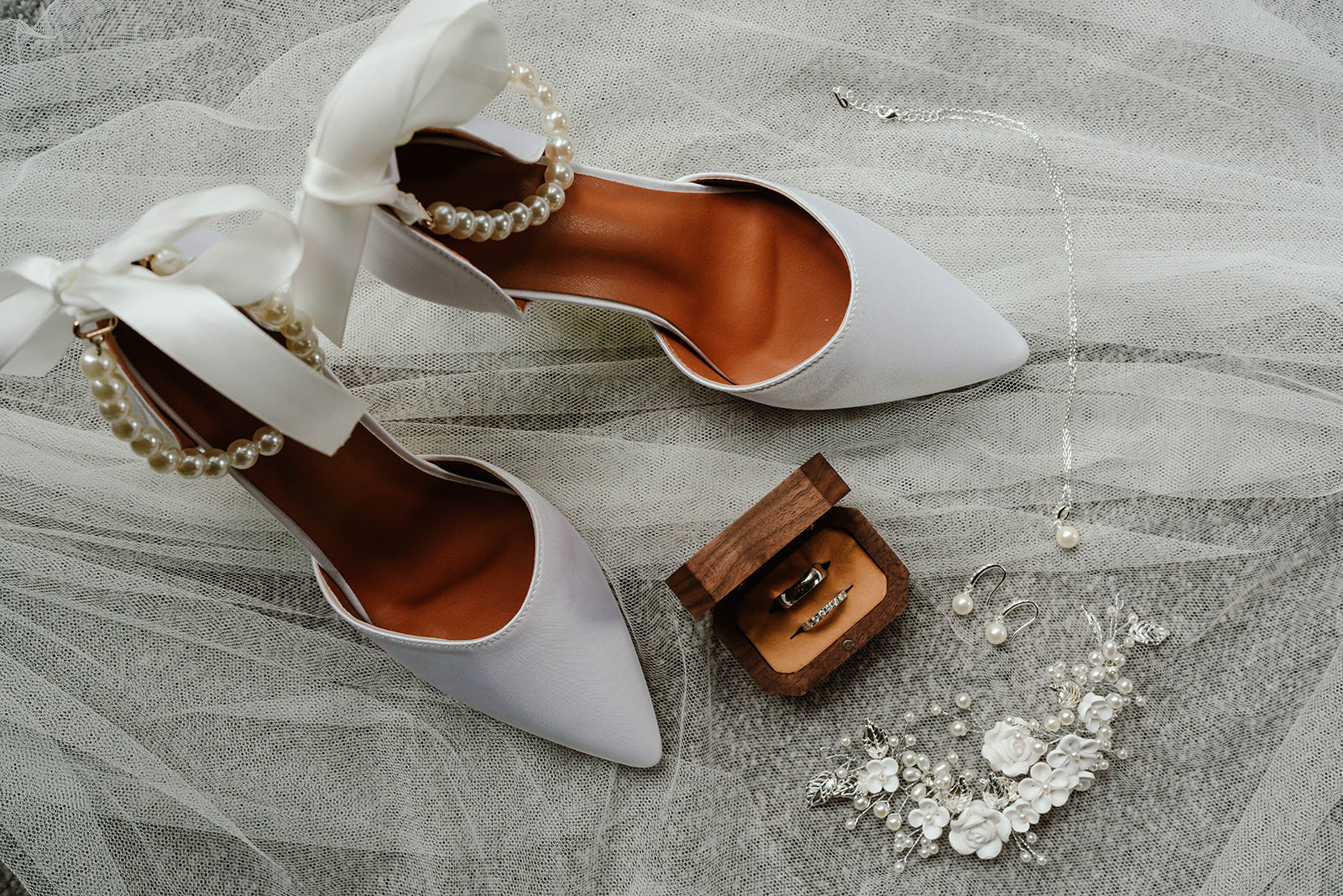 bridal shoes and jewelry on the veil