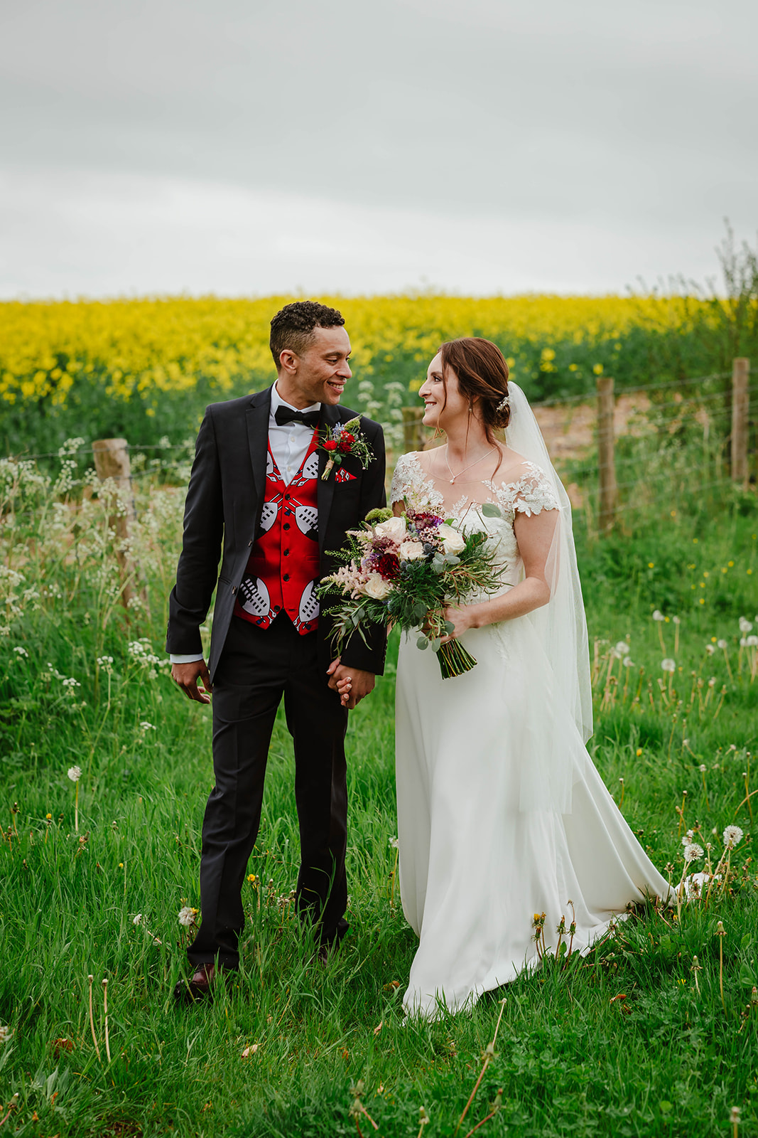 Bride and Groom laughing in fields