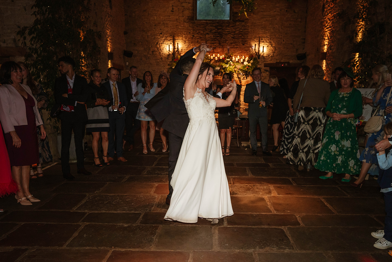 bride and groom twirling on the dancefloor