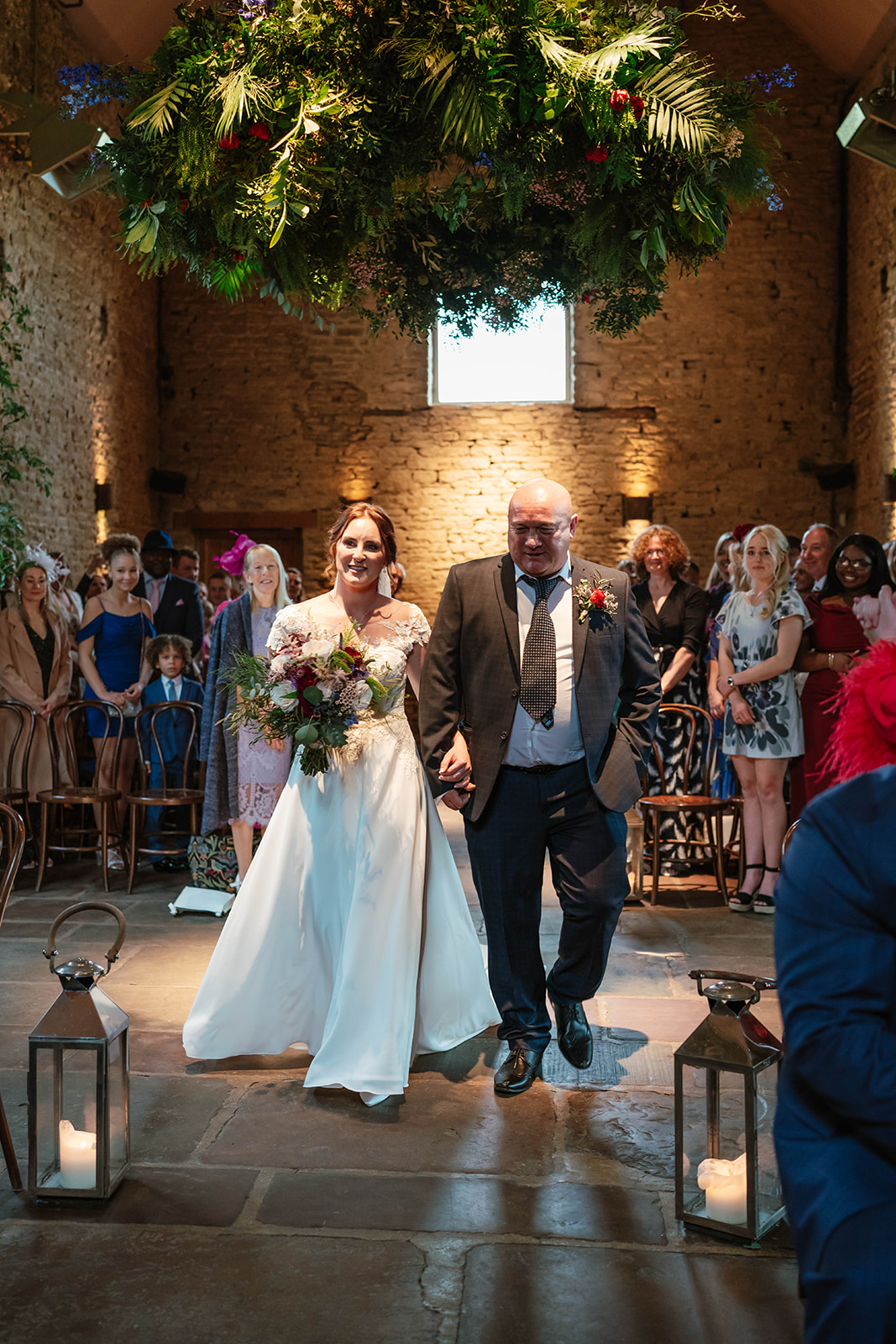 bride and her dad walking down the aisle at cripps barn
