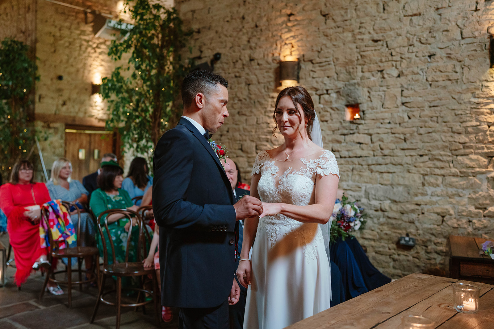 Ring exchange during ceremony at Cripps Barn