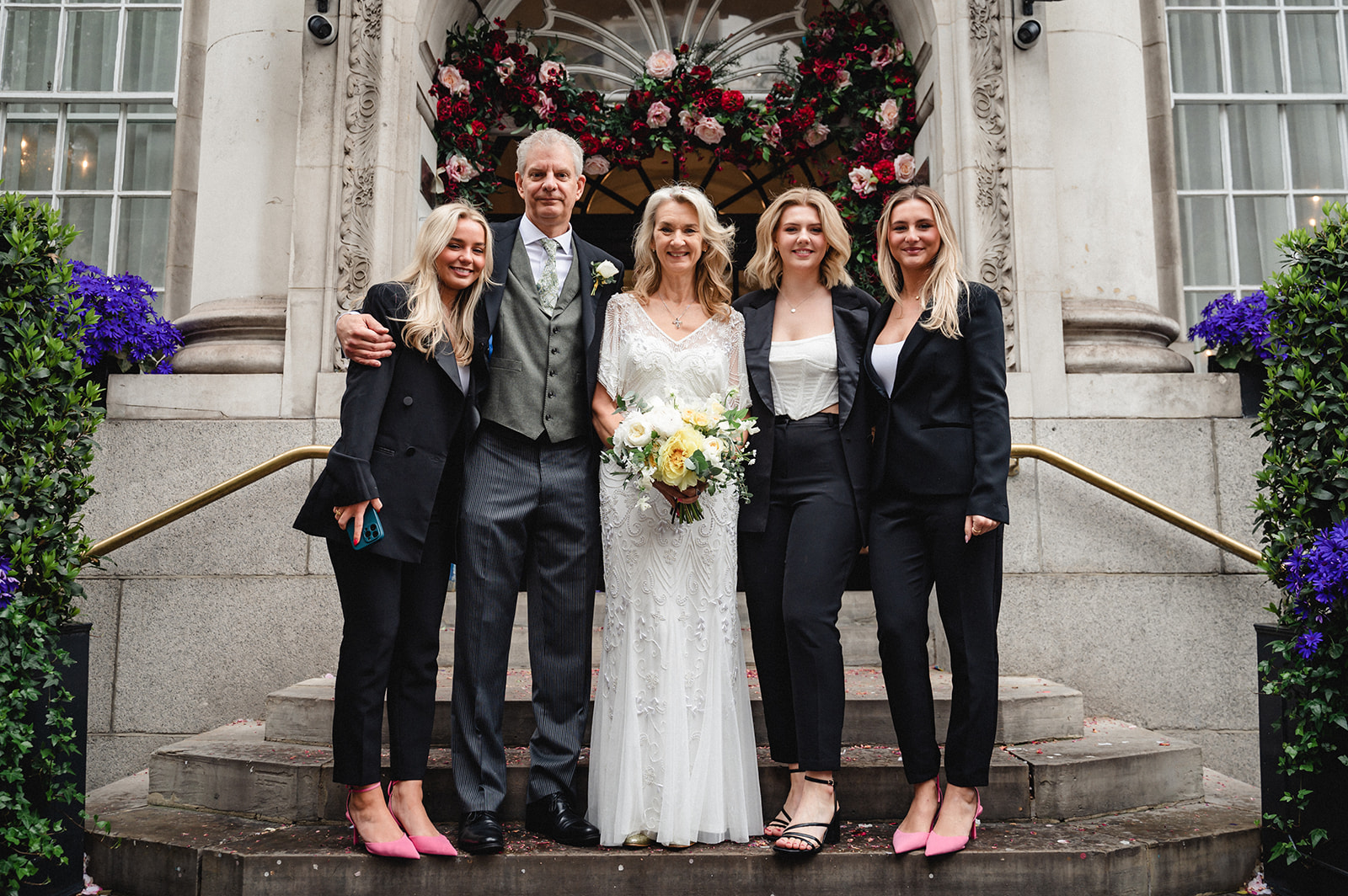Beautiful portrait of Lindsay and David's family on the steps of Chelsea Town Hall