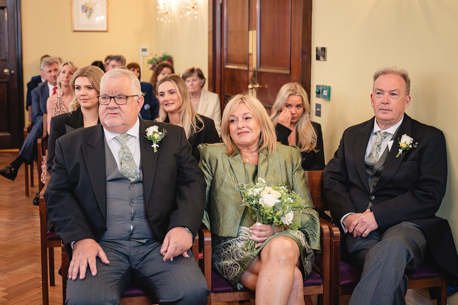Guests during the wedding ceremony in the Brydon Room at Chelsea Town Hall