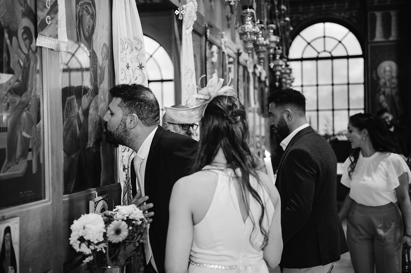 kissing the images in a greek christening