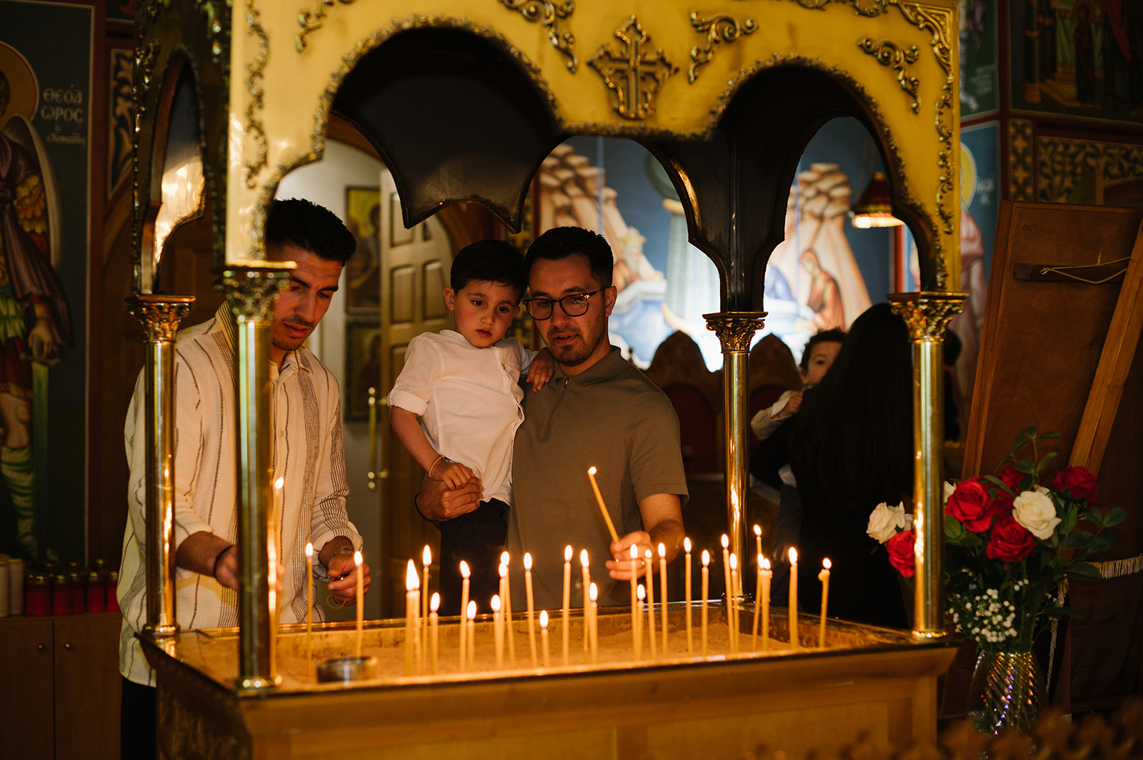 lighting a candle for a greek orthodox christening in erdington birmingham