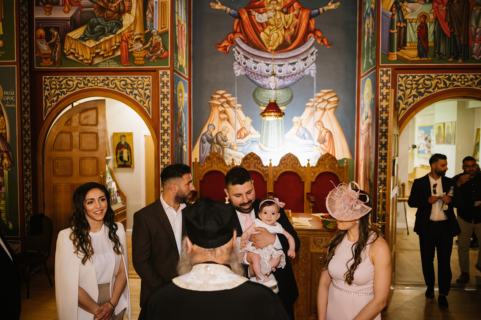 parents and god parents with the baby for her greek orthodox christening in erdington birmingham