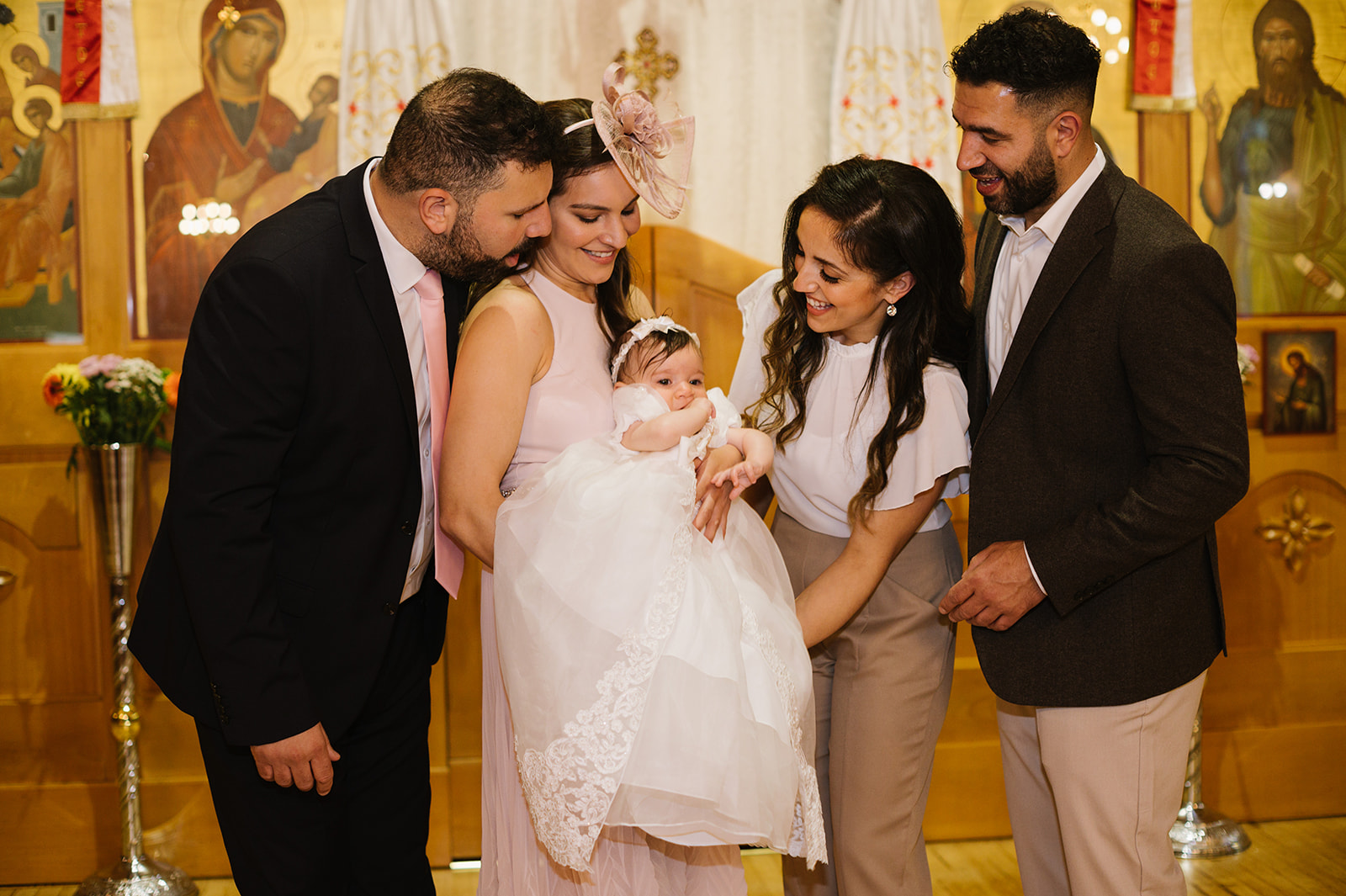 parents and godparents with the baby at a greek orthodox christening 