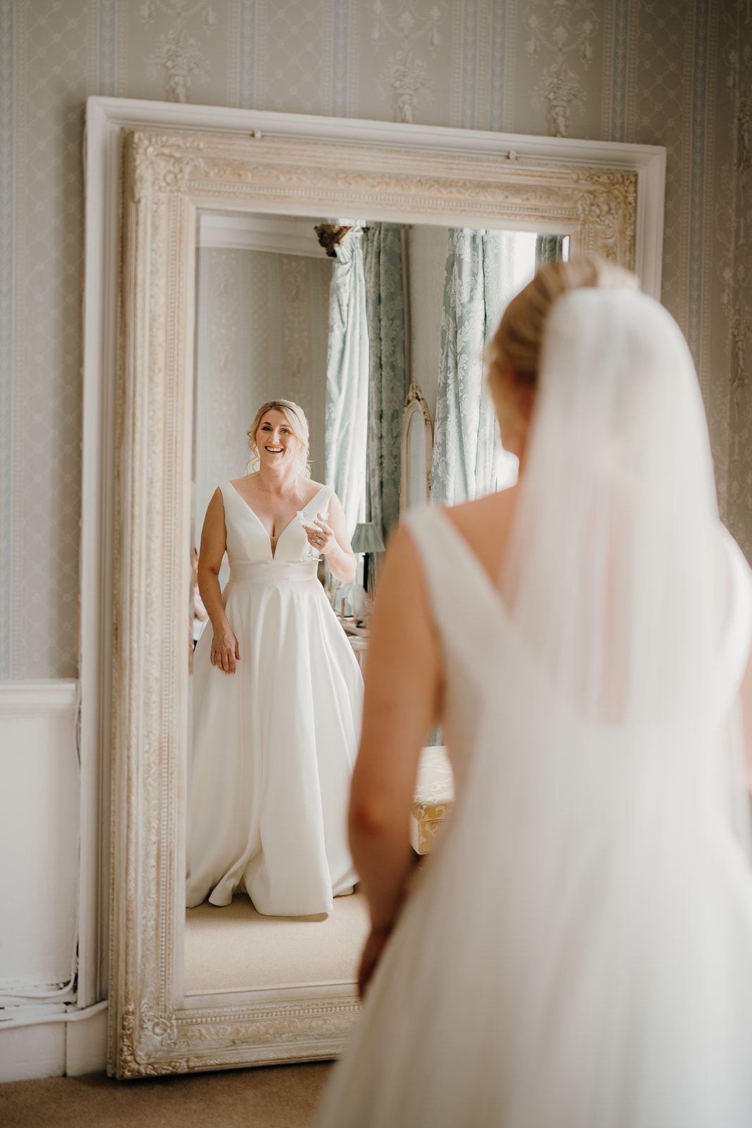 Bride seeing herself in the mirror