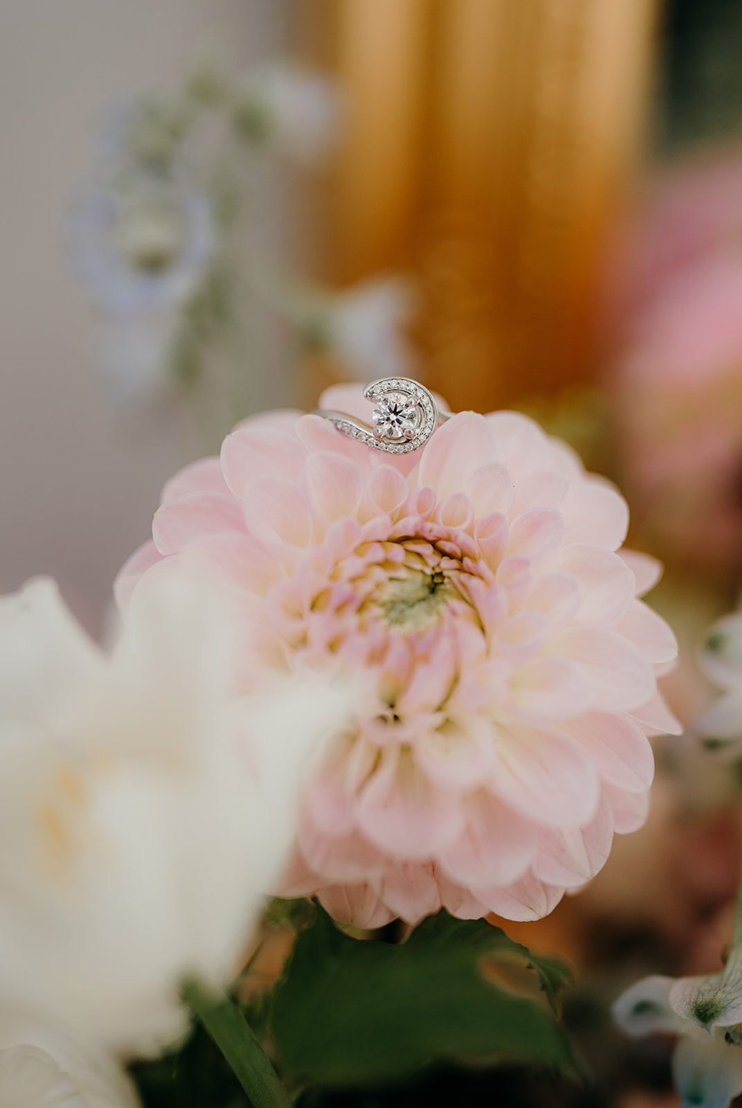 Close up of the engagement ring on the flowers
