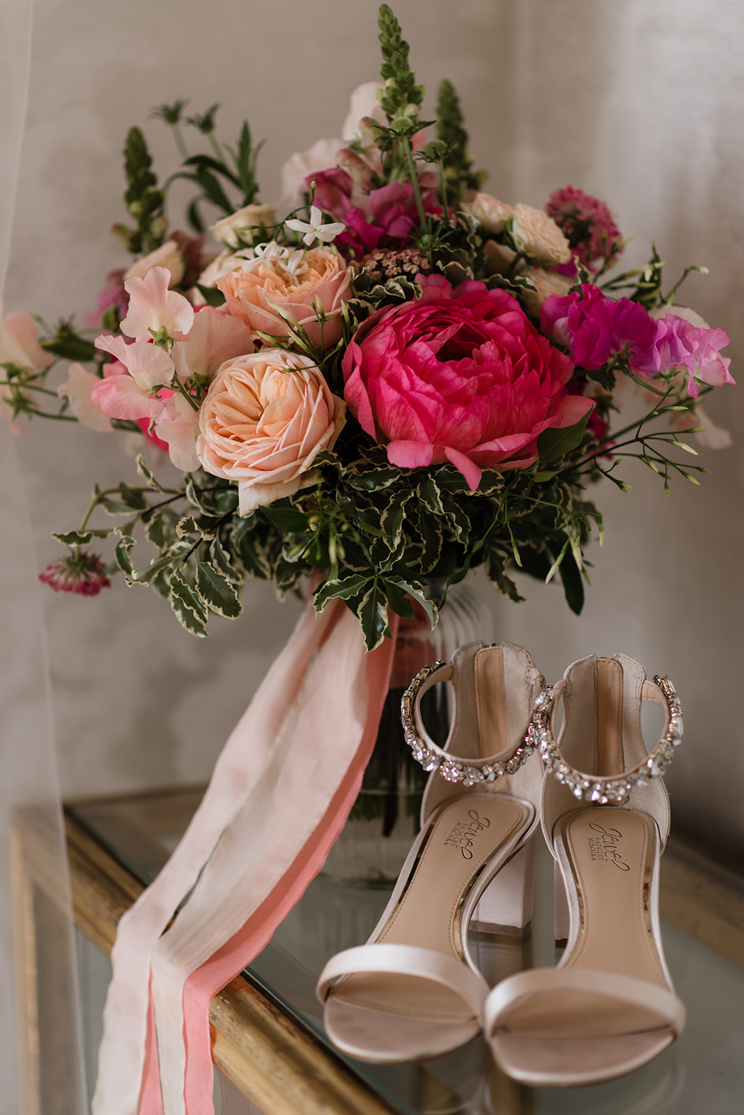 wedding bouquet and bridal shoes