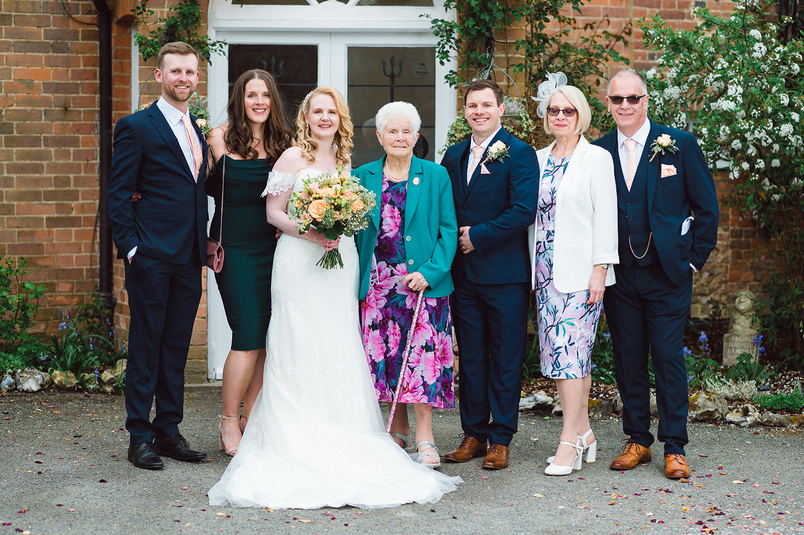 Joyous celebration and laughter as family and friends gather at Lewis and Sarah's wedding at The Old Rectory, Berkshire